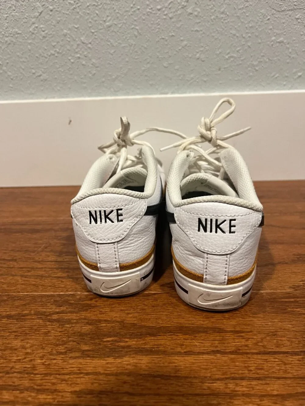 Nike Court Legacy White Sneakers with Black Swoosh and Tan Accent